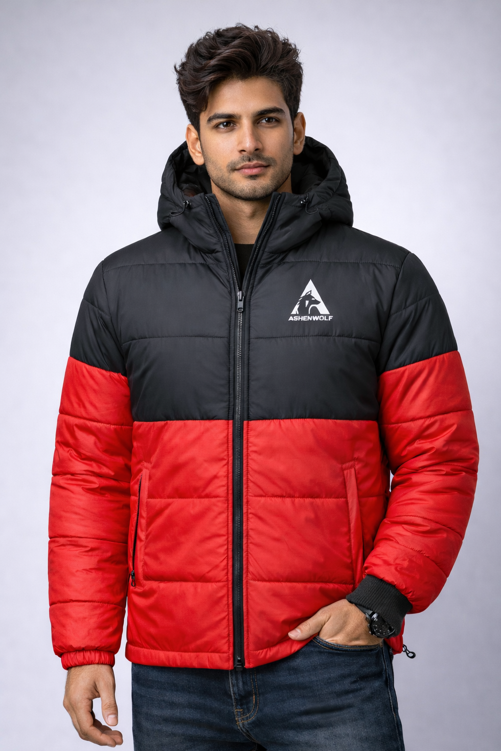 Model wearing a red and black Ashenwolf puffer jacket with hood up.